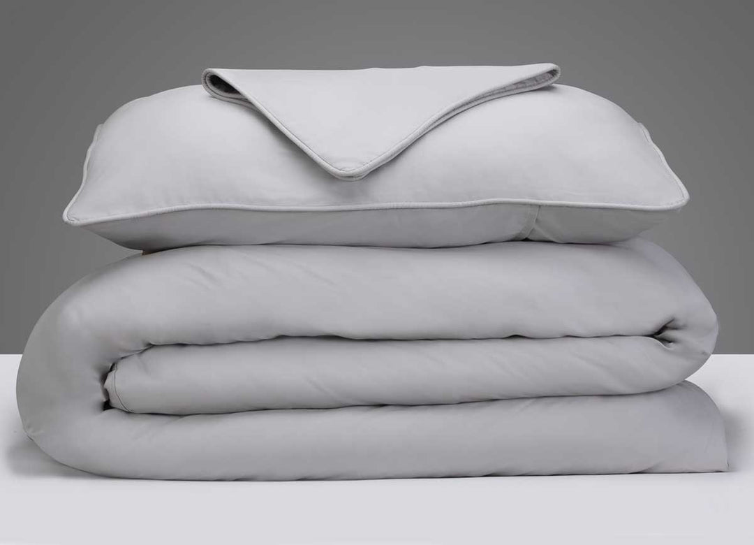 Arctic Aire Duvet Set Image Shown Folded and Stacked in Silver #choose-your-color_silver