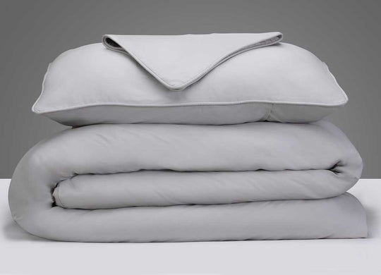 Arctic Aire Duvet Set Image Shown Folded and Stacked in Silver #choose-your-color_silver