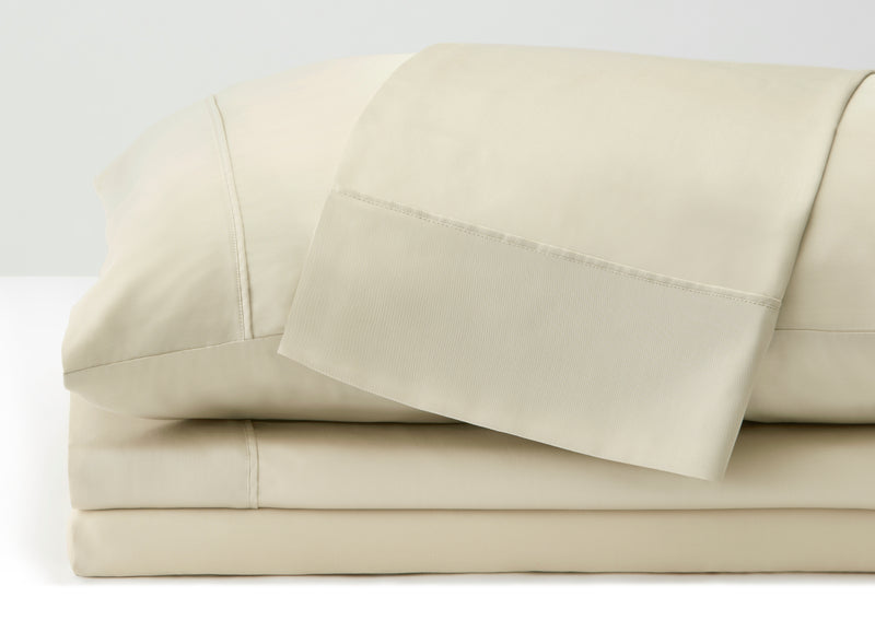 Arctic Aire•MAX Sheet Set on bed in room environment, Ivory #choose-your-color_ivory