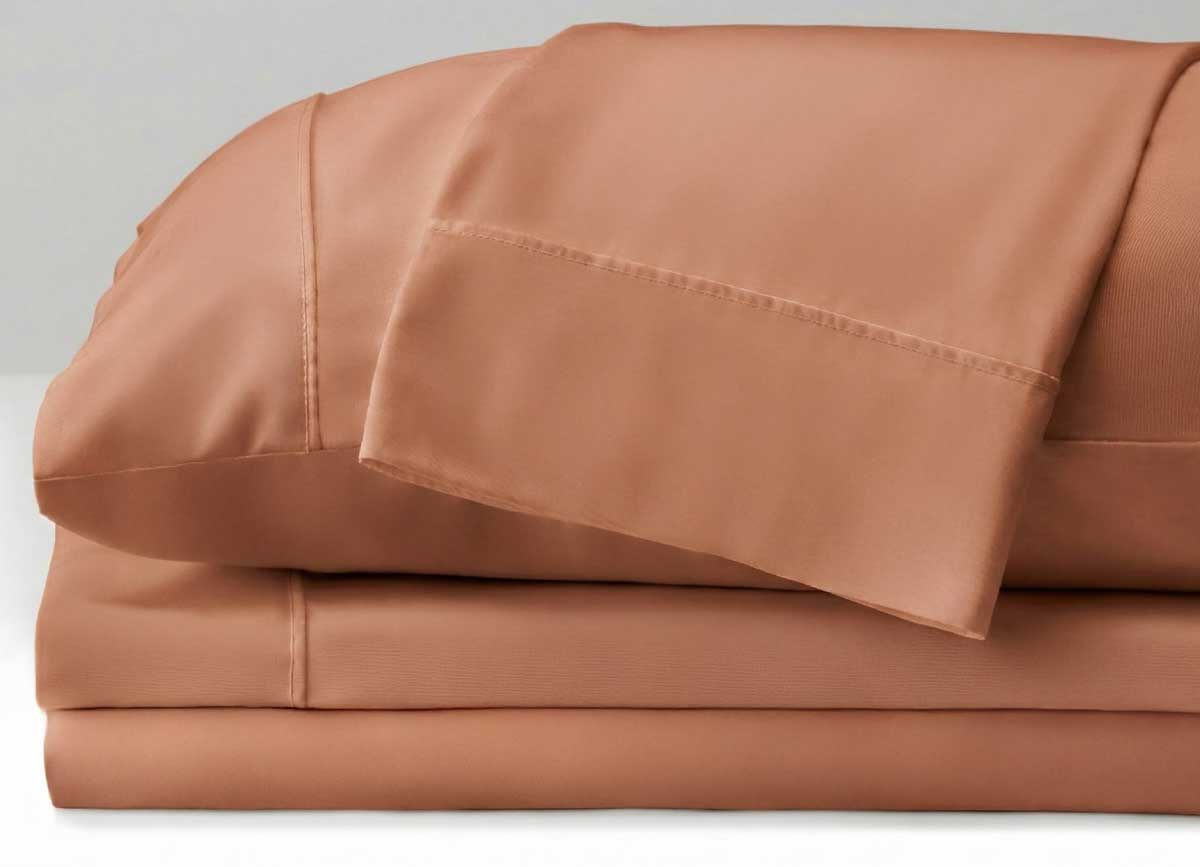 Stacked sheet set components of ARCTIC AIRE•MAX Sheet Set shown in Sunlit Sienna #choose-your-color_sunlit-sienna