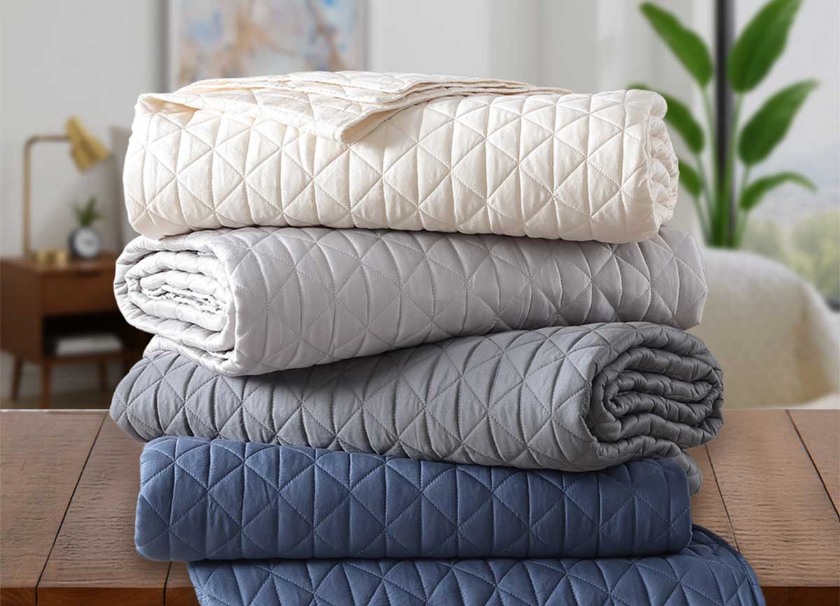Arctic Diamond Coverlets shown in ivory, silver, charcoal and navy.  #choose-your-color_ivory
