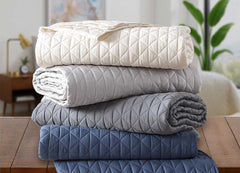 Arctic Diamond Coverlets shown in ivory, silver, charcoal and navy.  #choose-your-color_ivory