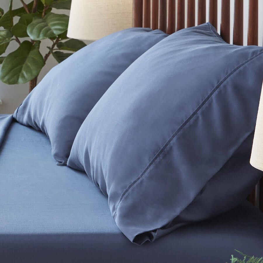 Arctic Aire•MAX Pillowcases on bed shown in blue
