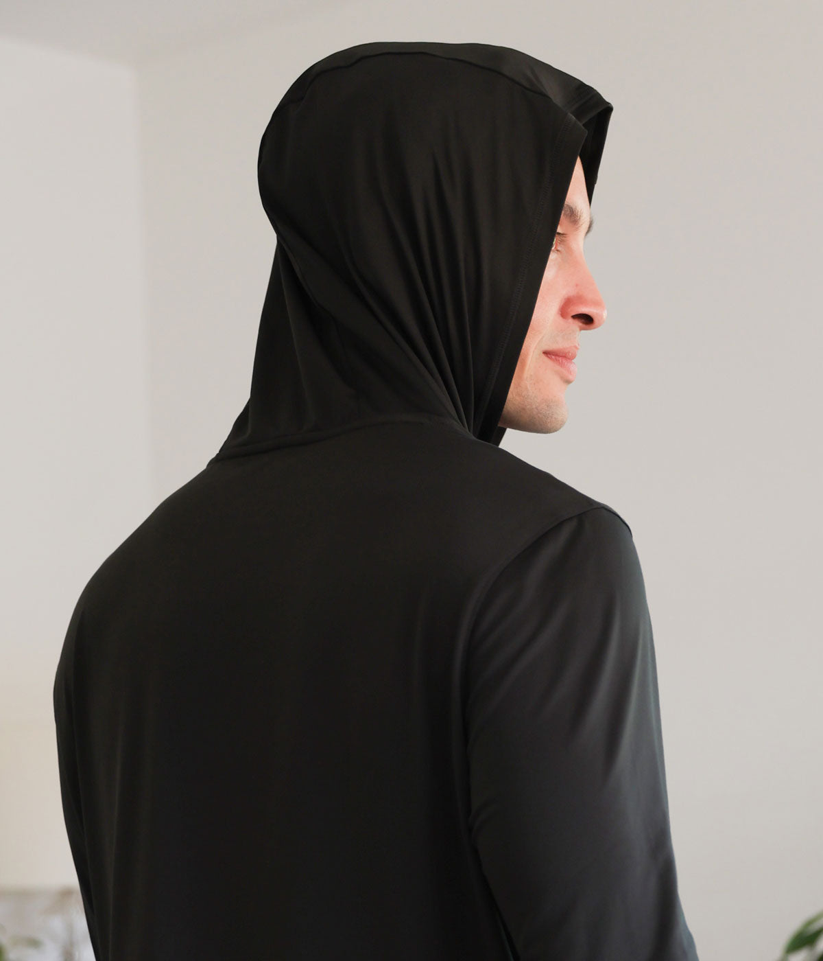 Model wearing black SHEEX Men's Hoodie #choose-your-color_black