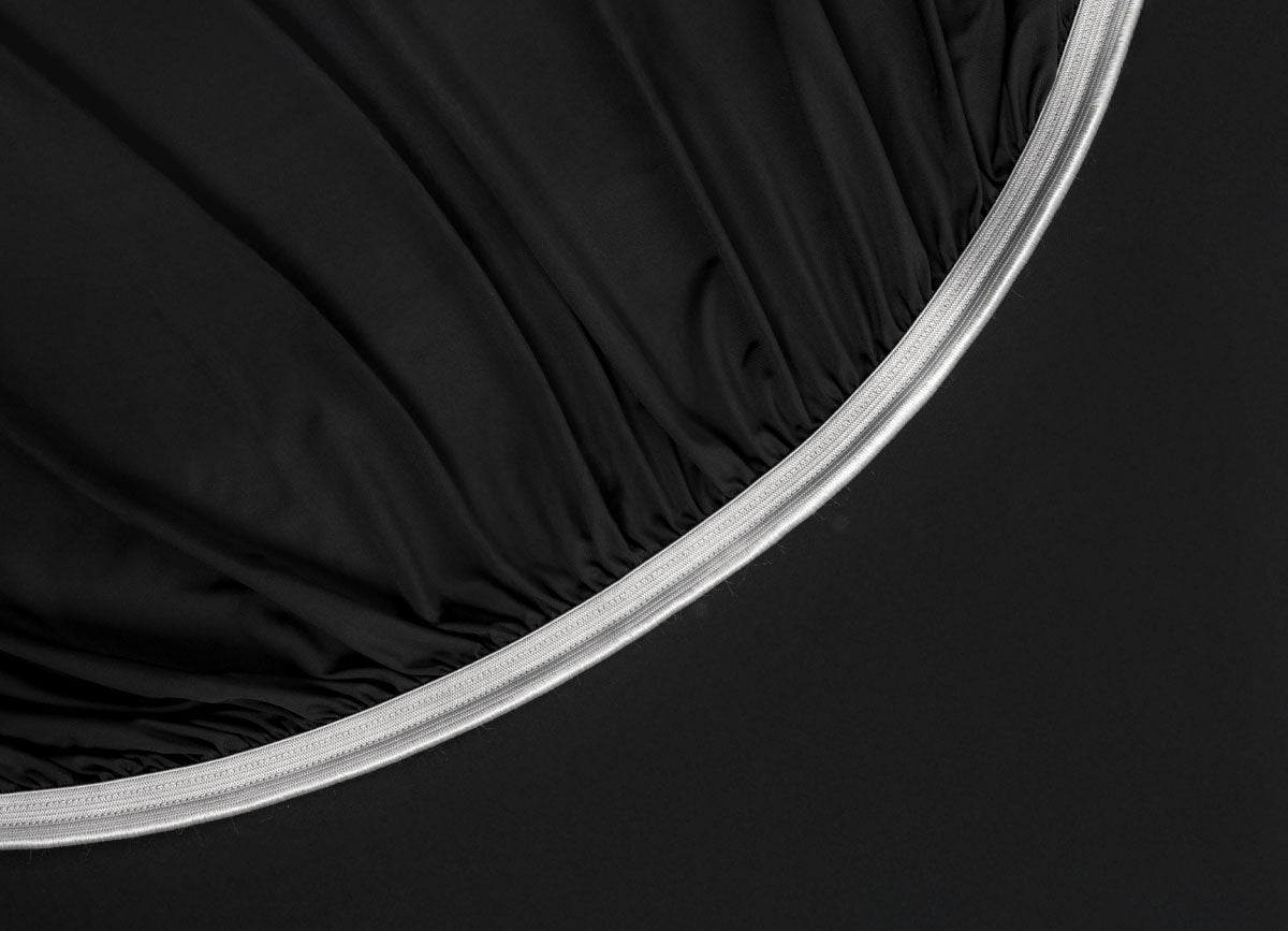 Detail image of athletic-grade elastic on Nightfall fitted sheet #choose-your-color_black-eclipse