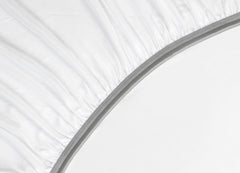 Detail image of athletic-grade elastic on Nightfall fitted sheet #choose-your-color_cloud-white