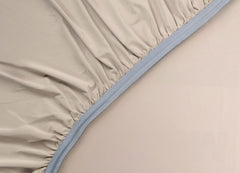 Detail image of athletic-grade elastic on Nightfall fitted sheet #choose-your-color_sand-dune