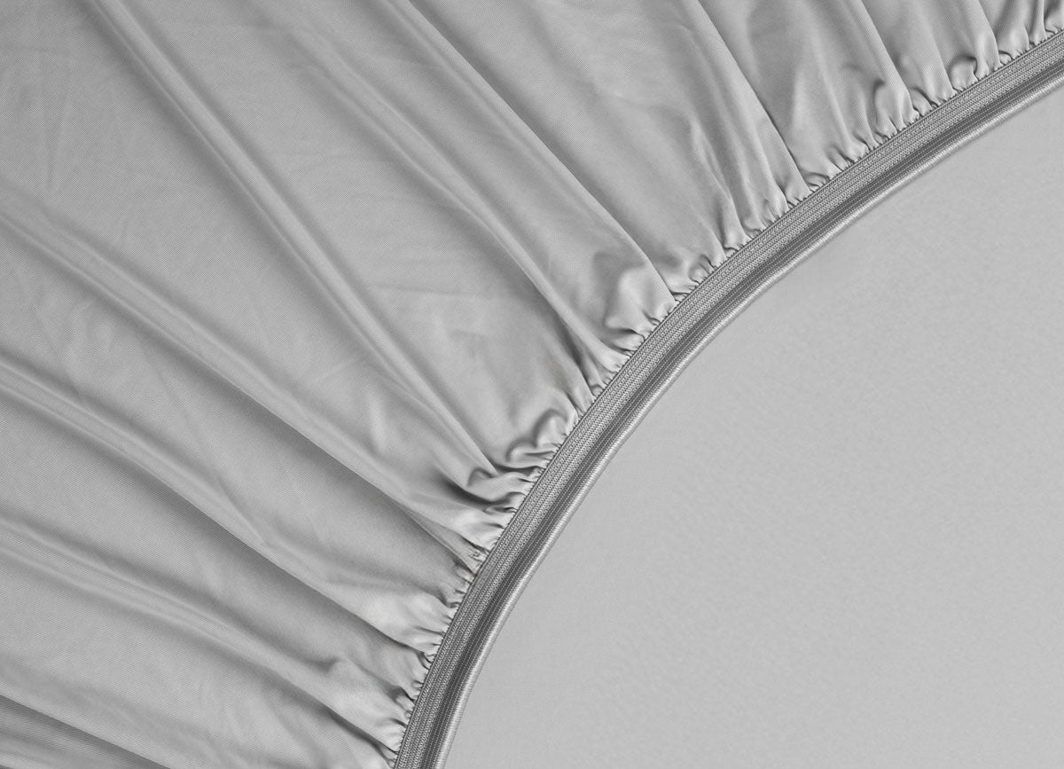 Detail image of athletic-grade elastic on Nightfall fitted sheet #choose-your-color_silver-dusk
