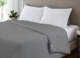 Graphite Original Performance All Season Comforter on bed