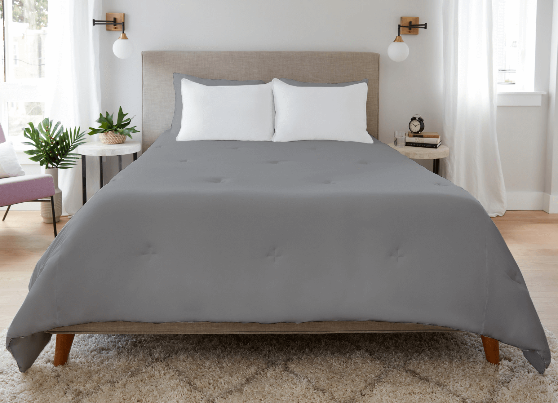Graphite Original Performance All Season Comforter on a bed.