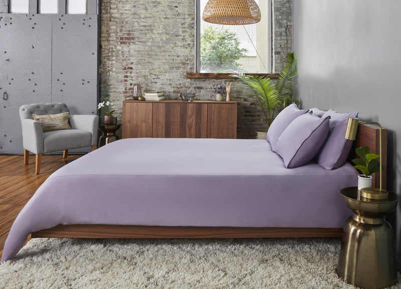 Lavender sheet set shown on bed in bedroom environment. #choose-your-color_lavender