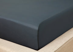 Original Performance Fitted Sheet shown on bed in forest green