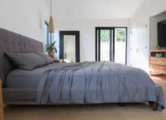 Graphite sheet set shown on bed in bedroom environment. #choose-your-color_graphite