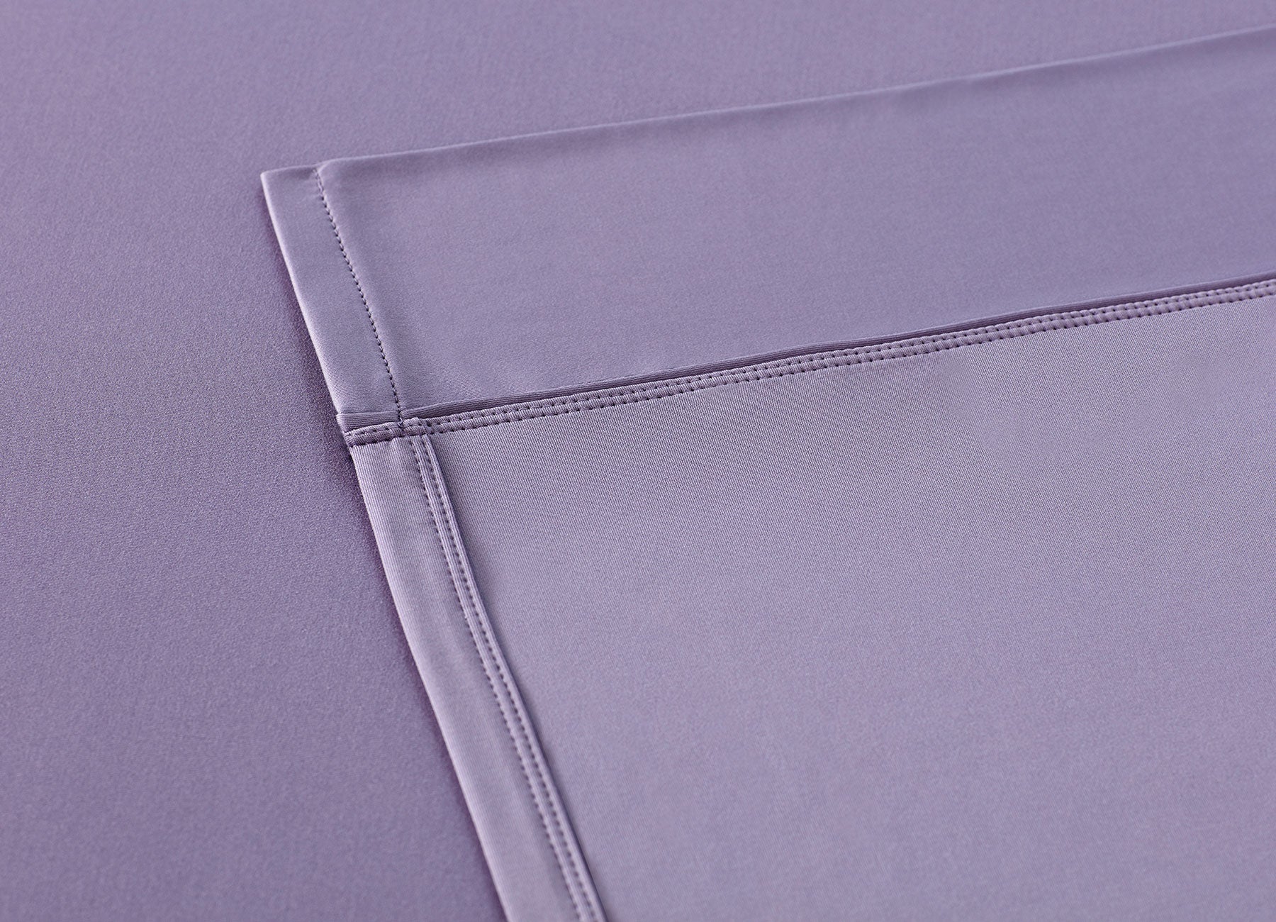 Lavender sheet set shown on bed in bedroom environment. #choose-your-color_lavender