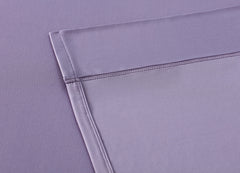 Lavender sheet set shown on bed in bedroom environment. #choose-your-color_lavender