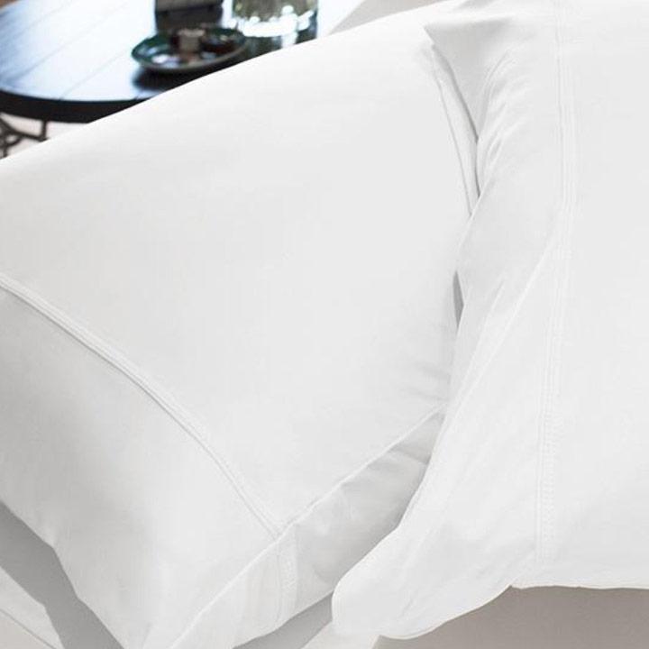 Bright White, Original Performance Pillowcase Pair shown on bed