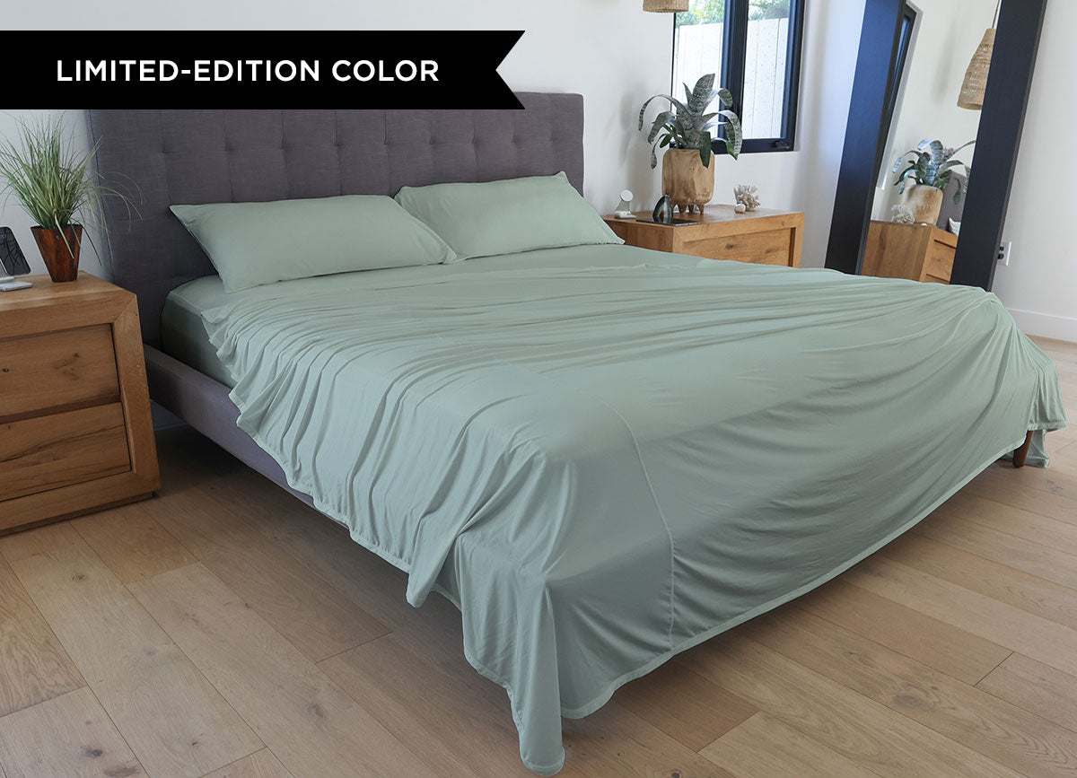 Serene Green sheet set shown on bed in bedroom environment. #choose-your-color_serene-green