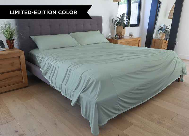 Serene Green sheet set shown on bed in bedroom environment. #choose-your-color_serene-green