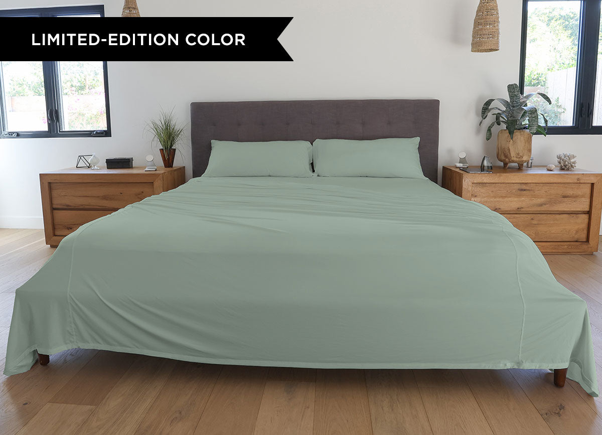 Serene Green sheet set shown on bed in bedroom environment. #choose-your-color_serene-green