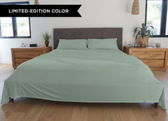 Serene Green sheet set shown on bed in bedroom environment. #choose-your-color_serene-green