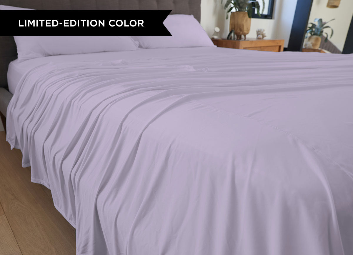 Silver Lilac sheet set shown on bed in bedroom environment. #choose-your-color_silver-lilac