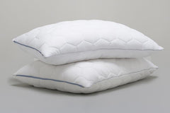 Two Stomach and Back Sleeper Pillows on gray background.