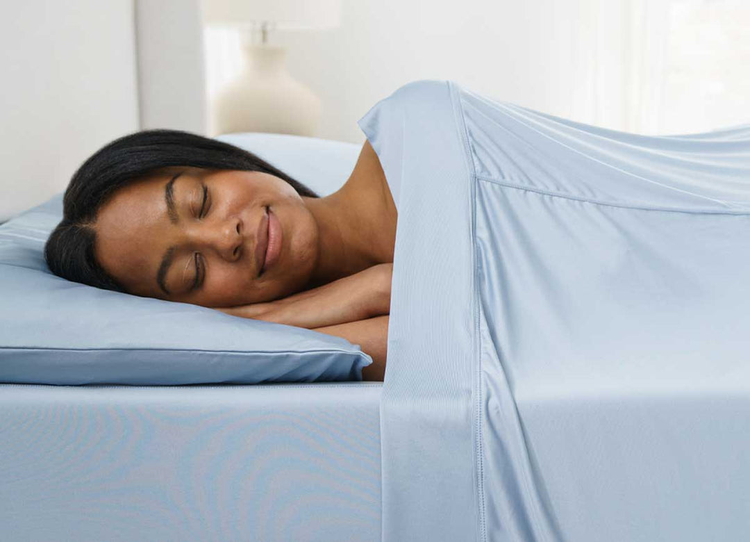 Active Comfort Sheet Set shown on bed with model #choose-your-color_blue-sky