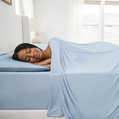 Active Comfort Sheet Set shown on bed with model #choose-your-color_blue-sky
