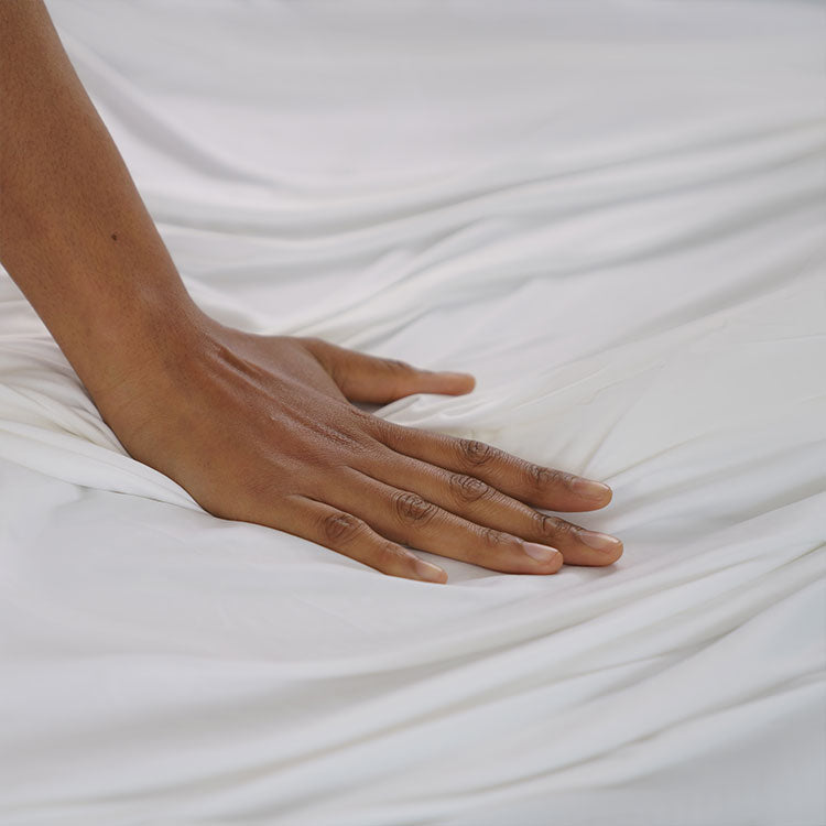 Detail shot of Active Comfort Sheet Set shown on bed #choose-your-color_bright-white