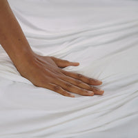 Detail shot of Active Comfort Sheet Set shown on bed #choose-your-color_bright-white