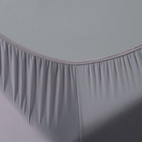 Corner detail image of Active Comfort Sheet Set shown on bed #choose-your-color_pewter