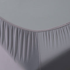 Corner detail image of Active Comfort Sheet Set shown on bed #choose-your-color_pewter