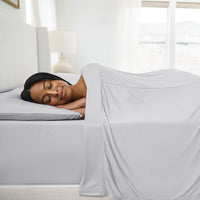 Active Comfort Sheet Set shown on bed with model #choose-your-color_silver-cloud