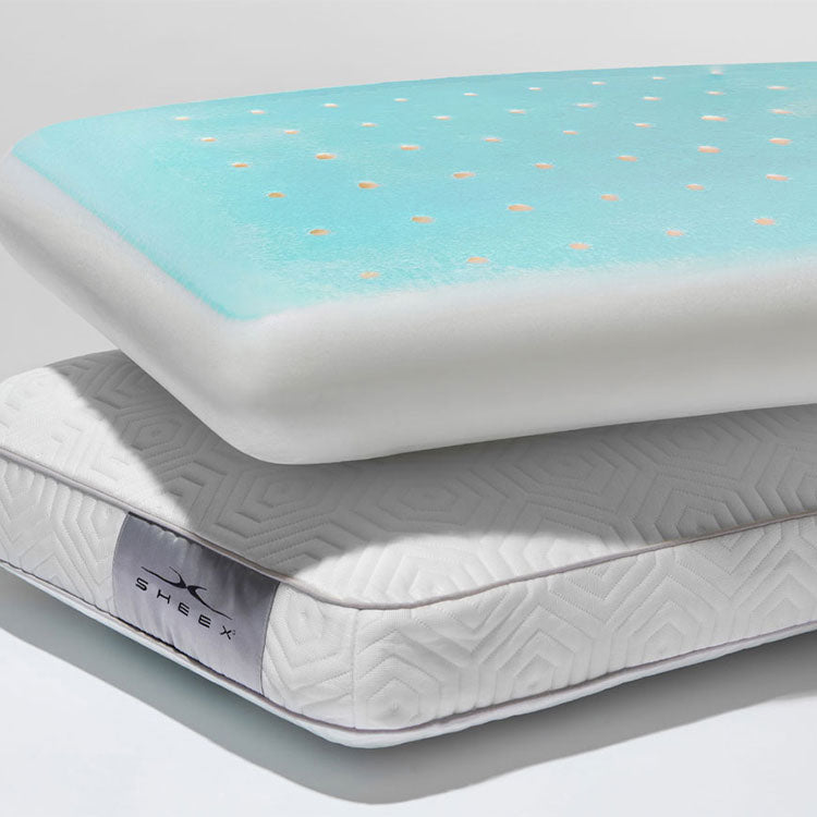 Two Infinite Zen pillows stacked together. Pillow on top has cover removed to reveal the grey cooling gel with holes poked in the top which demonstrates cooling and airflow. On a grey background.