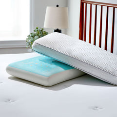 Two Infinite Zen pillows stacked together. Pillow on bottom has cover removed to reveal the grey cooling gel with holes poked in the top which demonstrates cooling and airflow. On a bed.