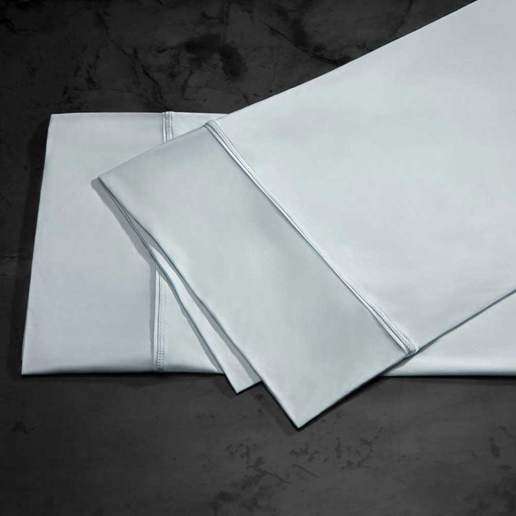 midnight label pillowcase stack shown in spa blue #choose-your-color_spa-blue