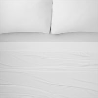 Nightfall Sheets and Pillowcases on a bed shown in Cloud White #choose-your-color_cloud-white