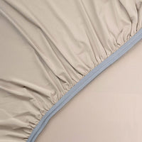 Detail image of athletic-grade elastic on Nightfall fitted sheet #choose-your-color_sand-dune