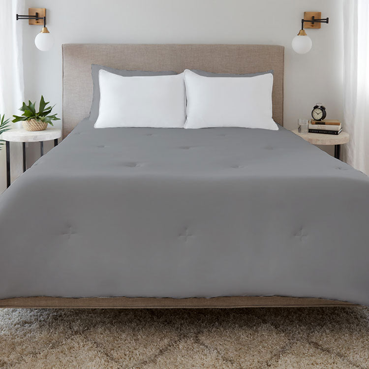 Graphite Original Performance All Season Comforter on a bed. #choose-your-color_graphite