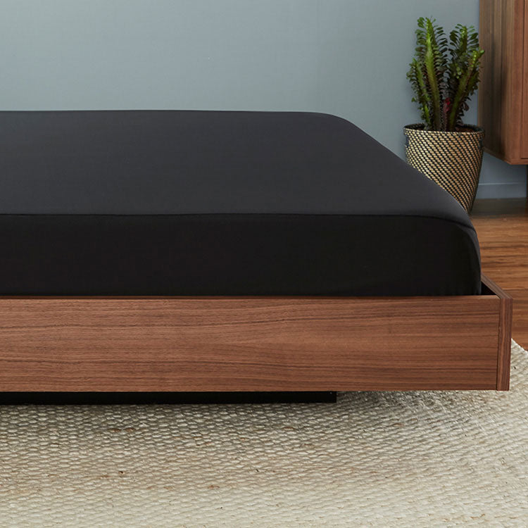 Original Performance Fitted Sheet on bed in Black #choose-your-color_black
