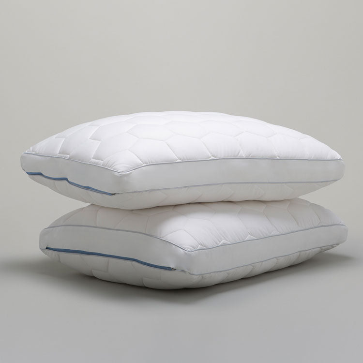 Two Original Performance Down Alternative Side Sleeper Pillows stacked on top of one another - Shown on a grey background.