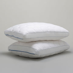 Two Original Performance Down Alternative Side Sleeper Pillows stacked on top of one another - Shown on a grey background.