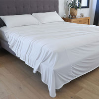 Bright White sheet set shown on bed in bedroom environment. #choose-your-color_bright-white