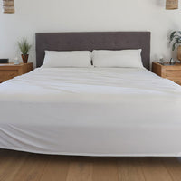 Bright White sheet set shown on bed in bedroom environment. #choose-your-color_bright-white