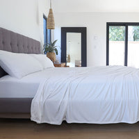 Bright White sheet set shown on bed in bedroom environment. #choose-your-color_bright-white