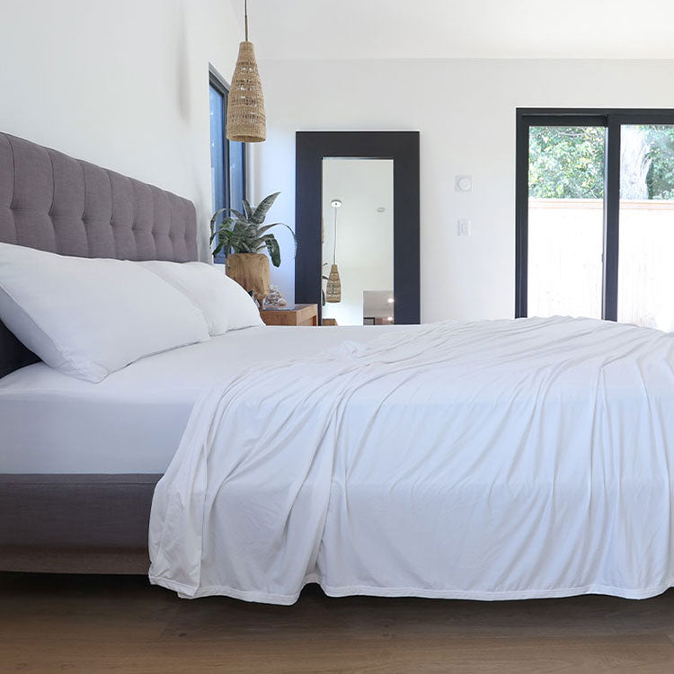 Bright White sheet set shown on bed in bedroom environment. #choose-your-color_bright-white