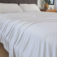 Bright White sheet set shown on bed in bedroom environment. #choose-your-color_bright-white