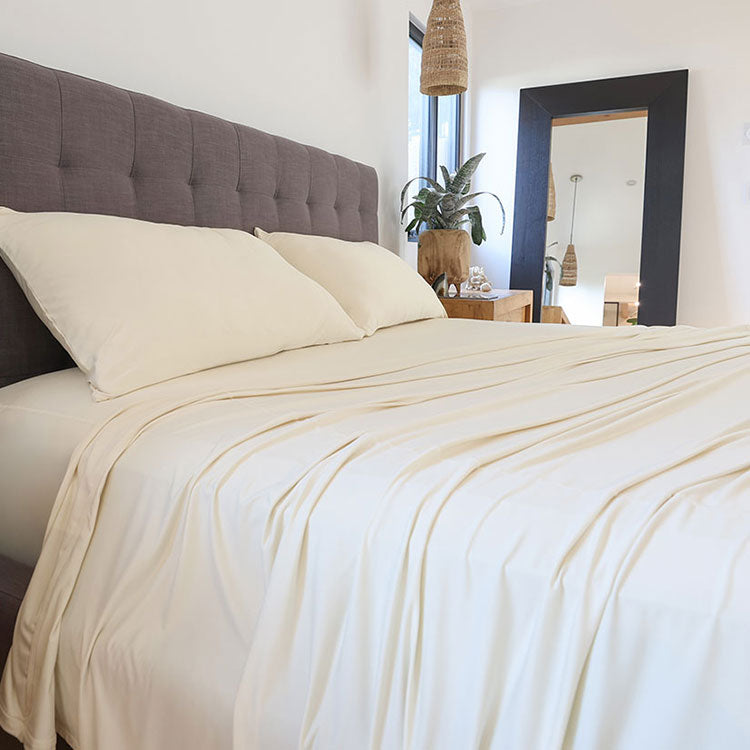 Ecru sheet set shown on bed in bedroom environment. #choose-your-color_ecru
