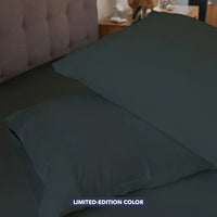 Fresh Meadow pillowcase set shown on bed in bedroom environment. #choose-your-color_fresh-meadow