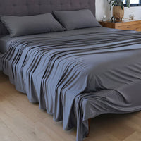 Graphite sheet set shown on bed in bedroom environment. #choose-your-color_graphite